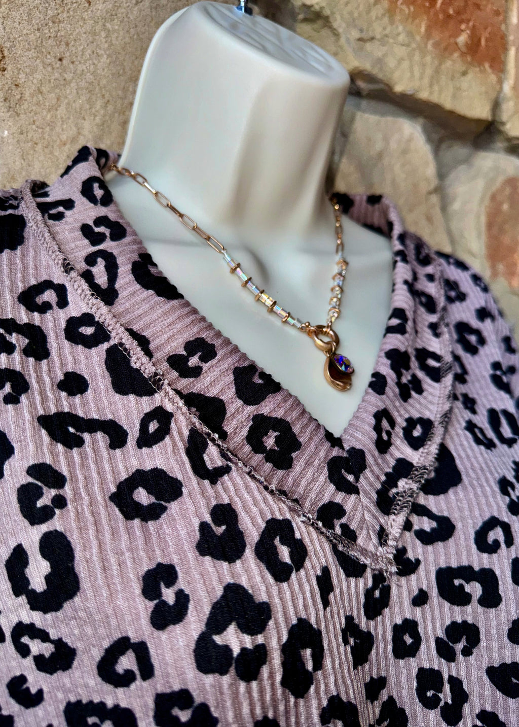 Leopard exposed hem top